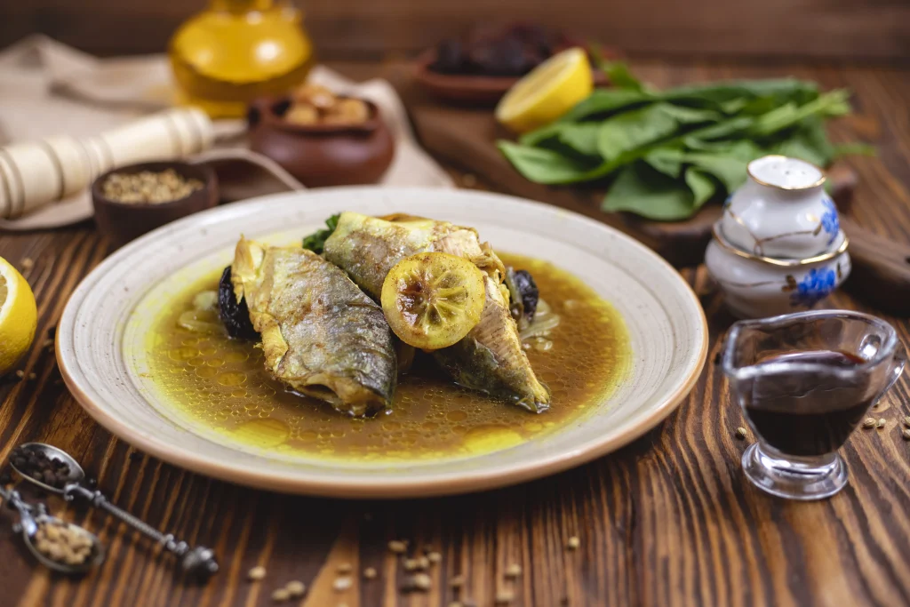 fish-oily-sauce-spinach-lemon-spices-side-view